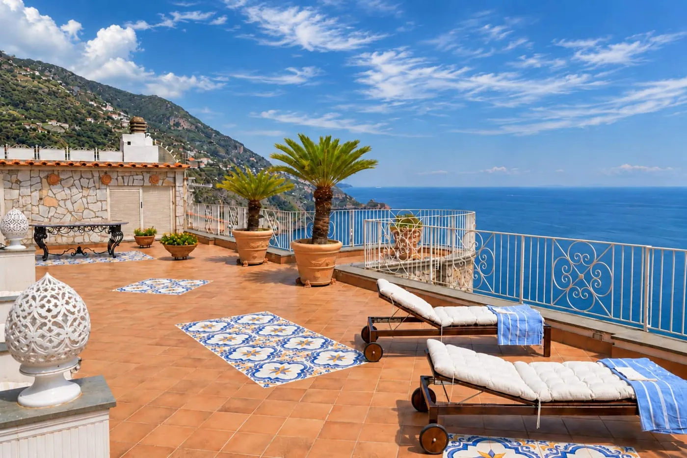 Rooftop with sun loungers and sea view